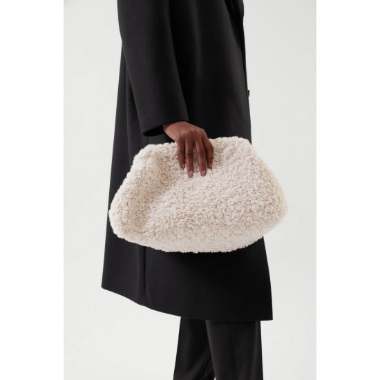COS' most wanted teddy clutch is finally back in stock